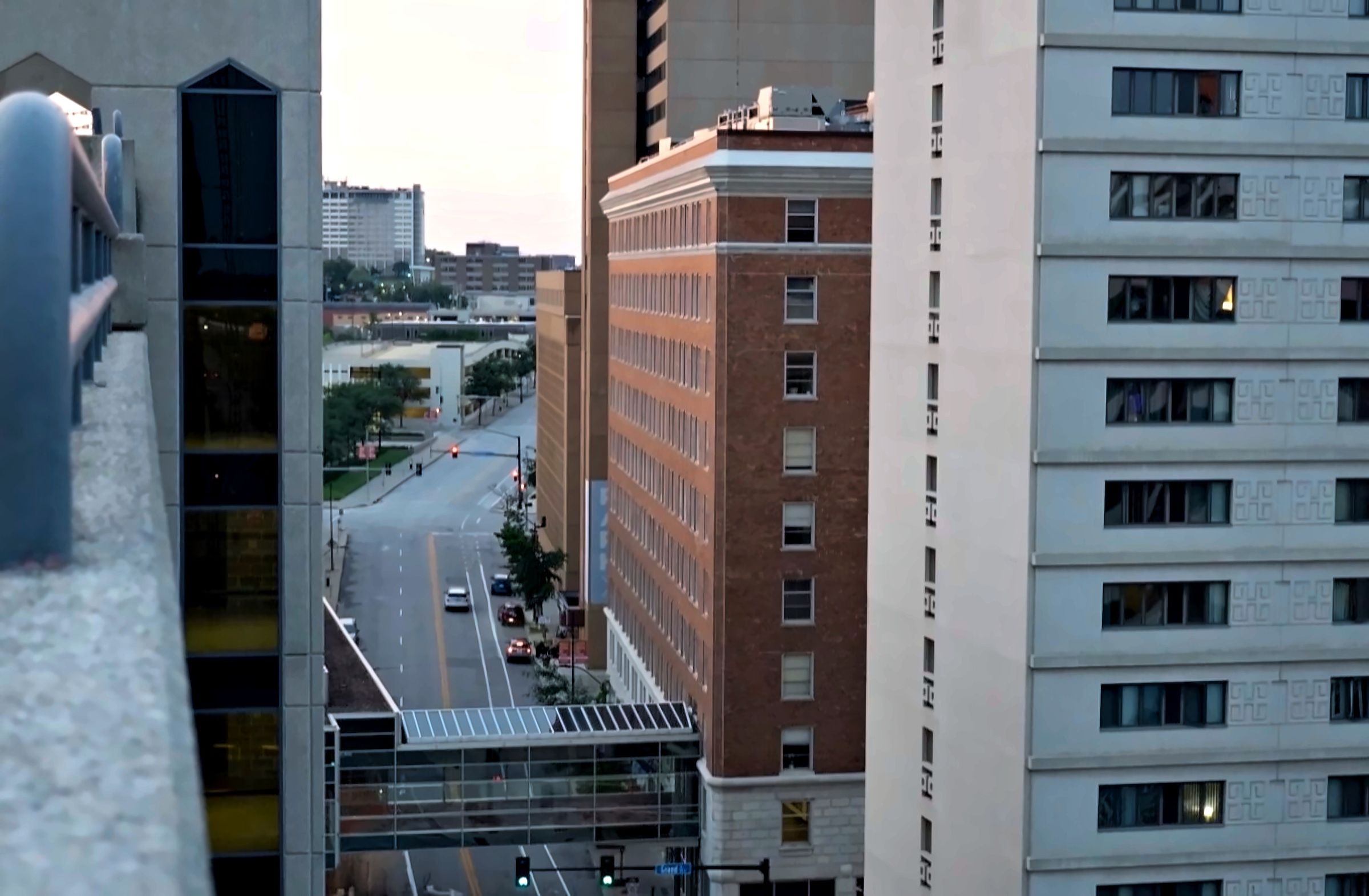 View down a downtown Des Moines street between brick and stone towers